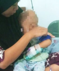 Terjebak di Antara Dua Alamat. Perjuangan Balita Mendapatkan Hak Gizi